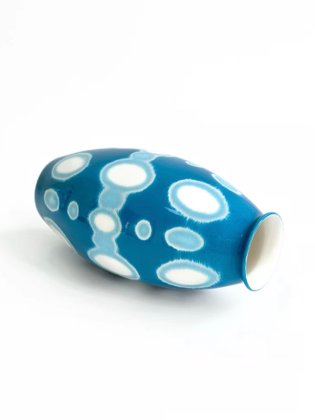 Teal blue ceramic vase with white polka dot pattern, single oval shape, TalkFun collection