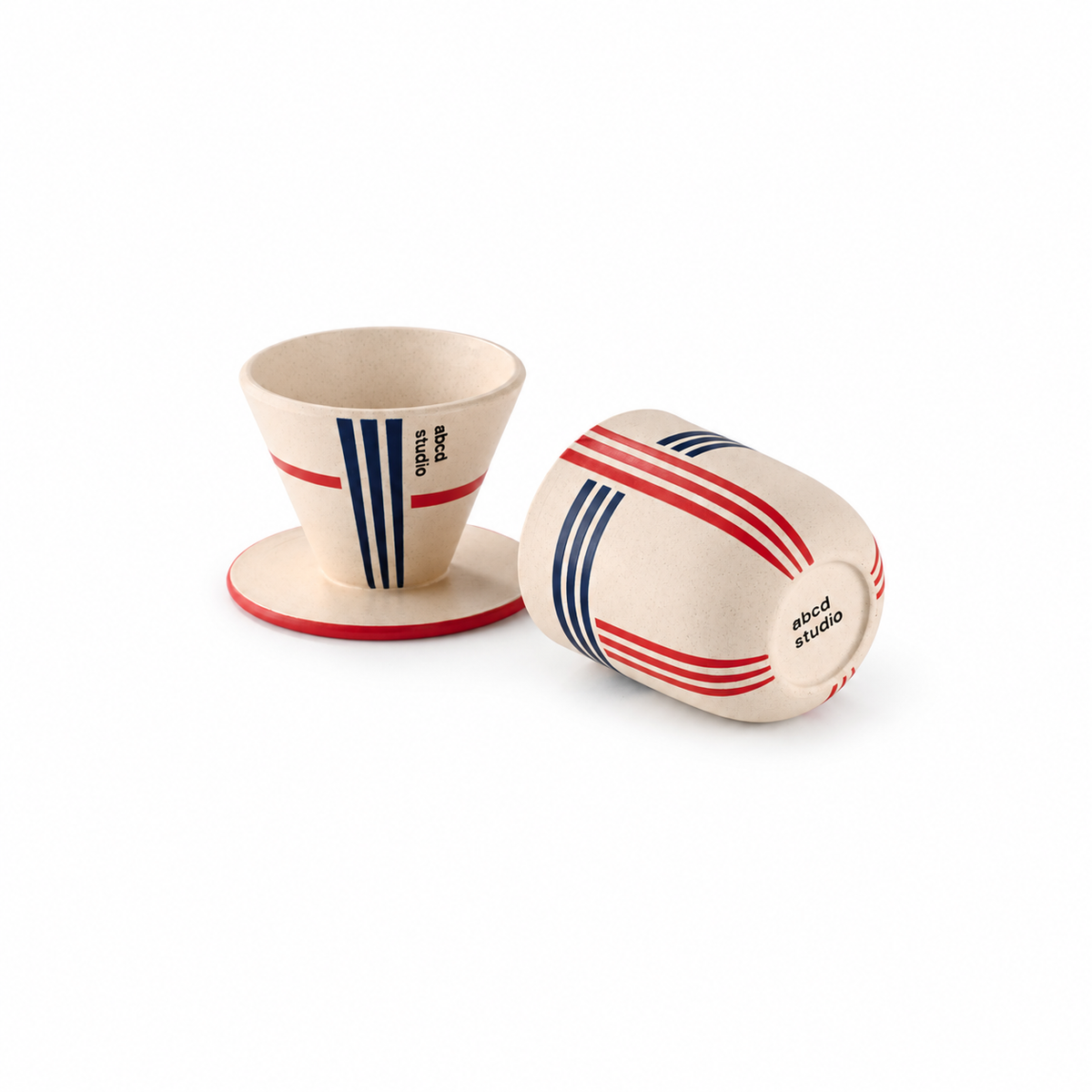 Linework ceramic pour-over coffee dripper and cup set by abcd studio, cream glaze with red and navy stripes, shown separated