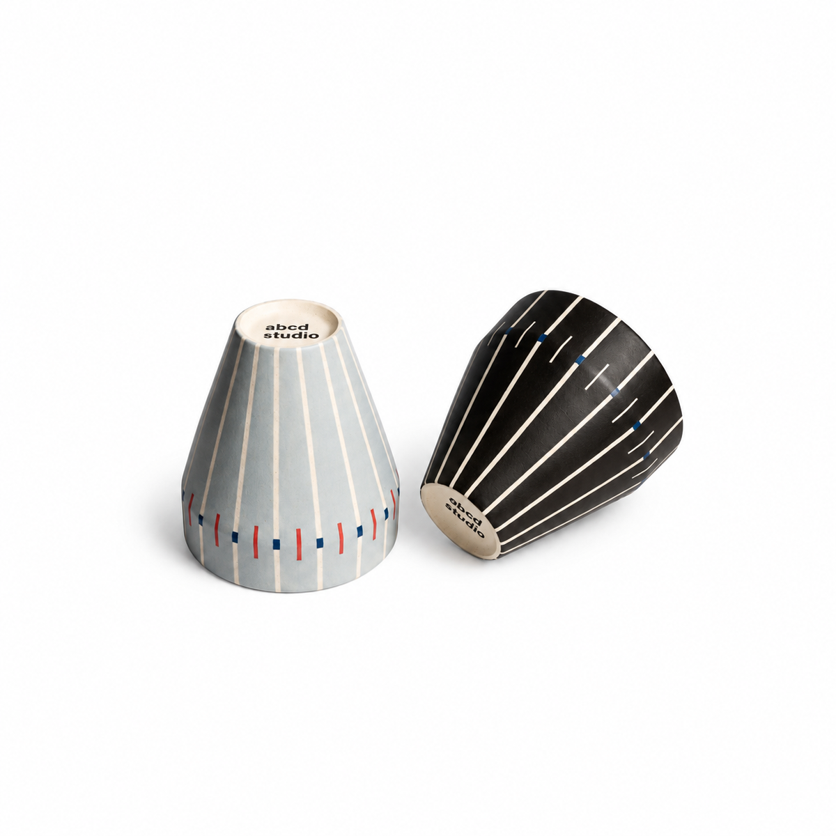 Grey-blue and black Linework ceramic tumblers by abcd studio, hand-painted vertical line and dash pattern