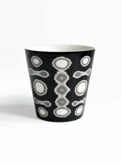 Black ceramic tea cup with grey and white circle pattern, tall tapered shape, TalkFun collection
